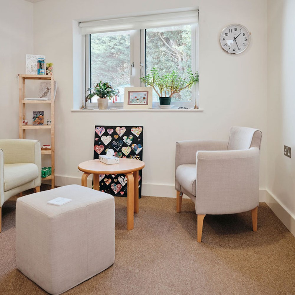 Image of bereavement counselling room, two chairs and box of tissues on table 