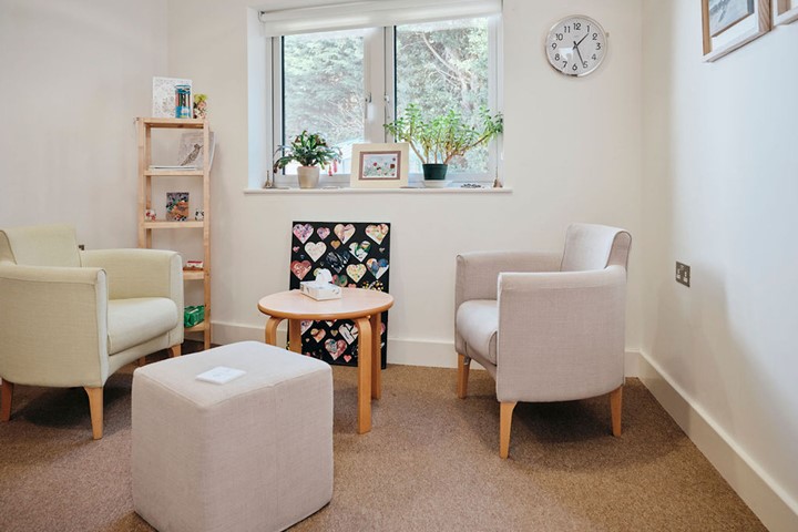 Image of bereavement counselling room, two chairs and box of tissues on table 