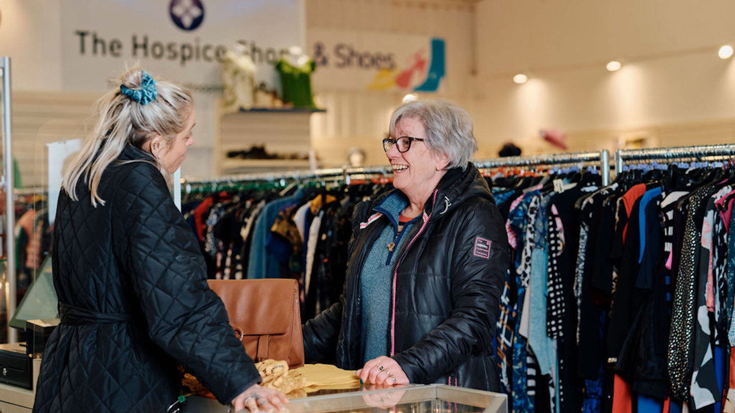 Image of customer buying clothes in st ouens store