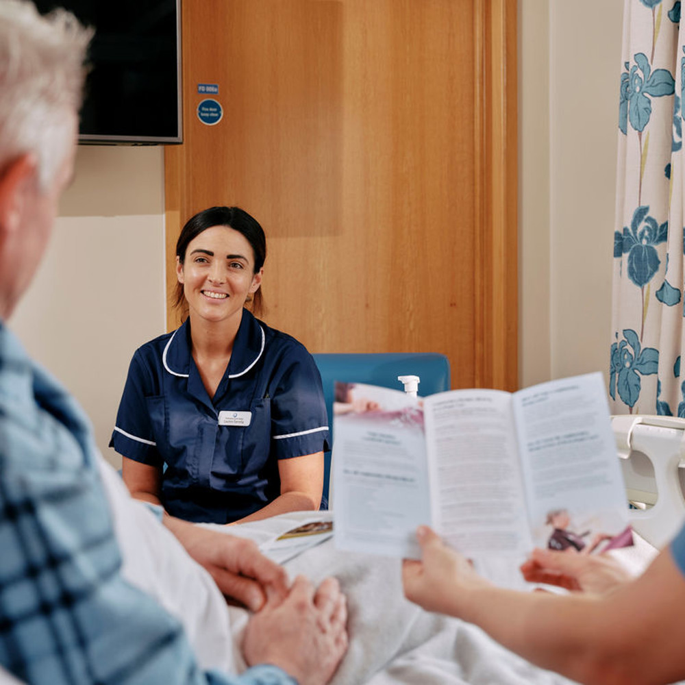 Nurse and patient with leaflet