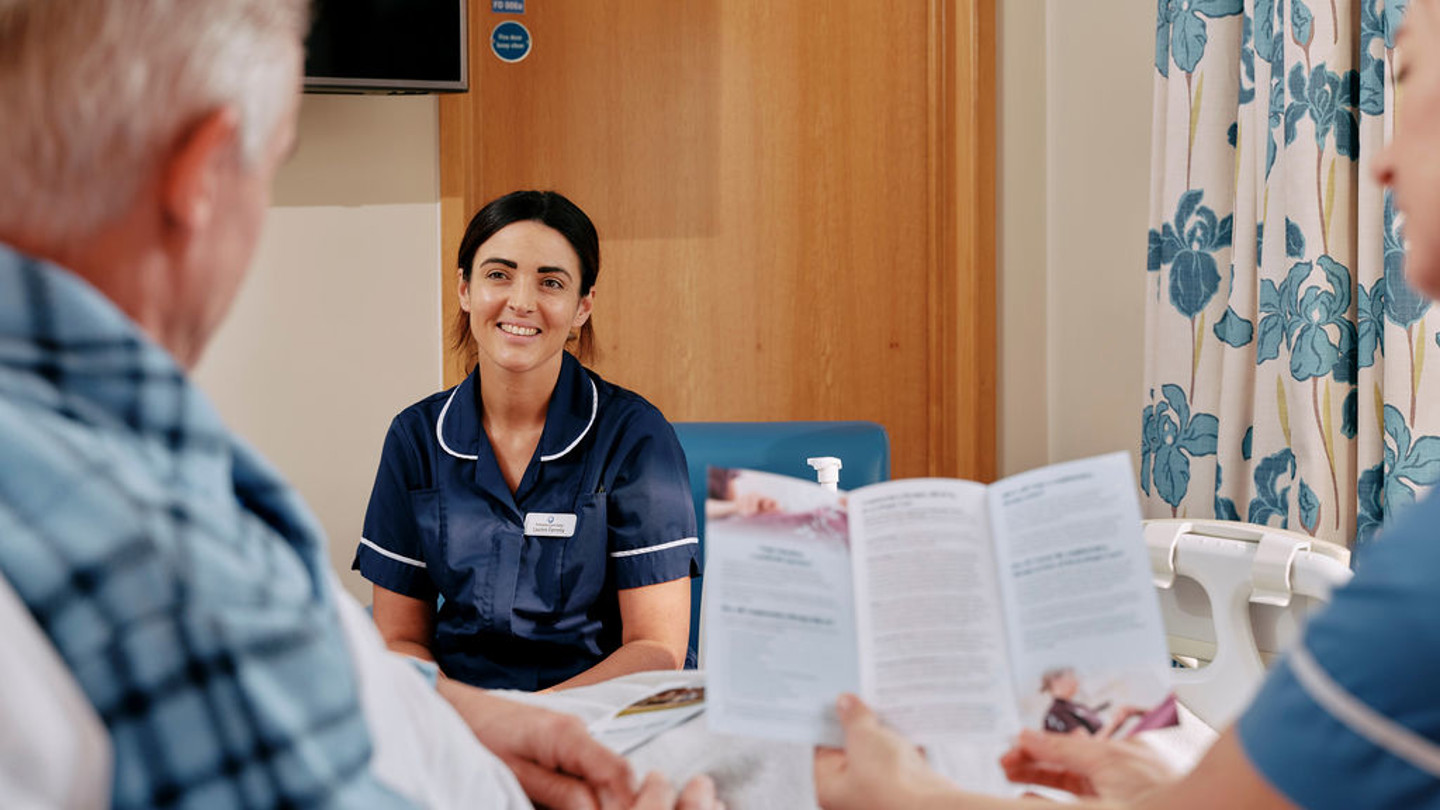 Nurse and patient with leaflet