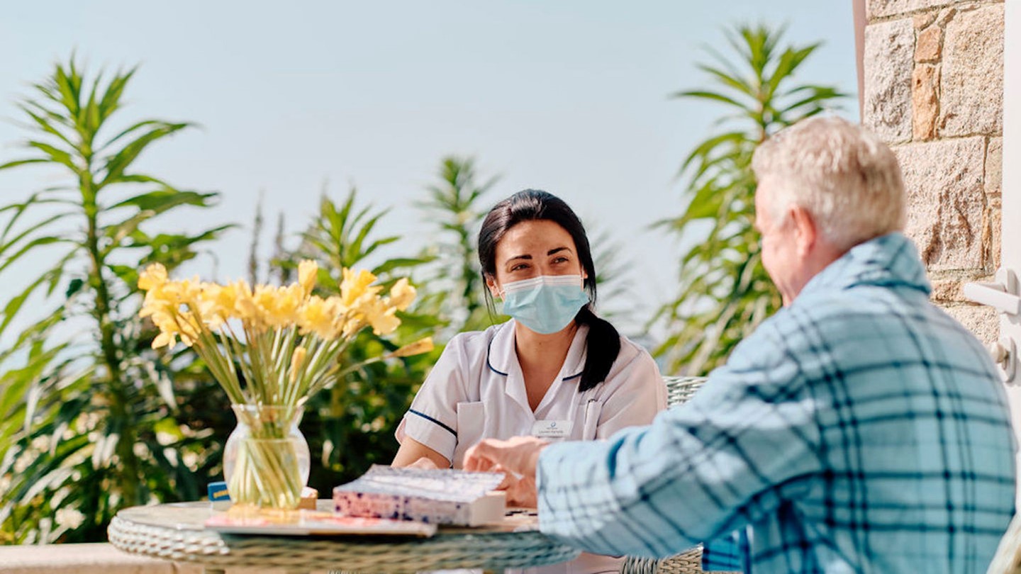 Image of Hospice nurse and patient in gardens