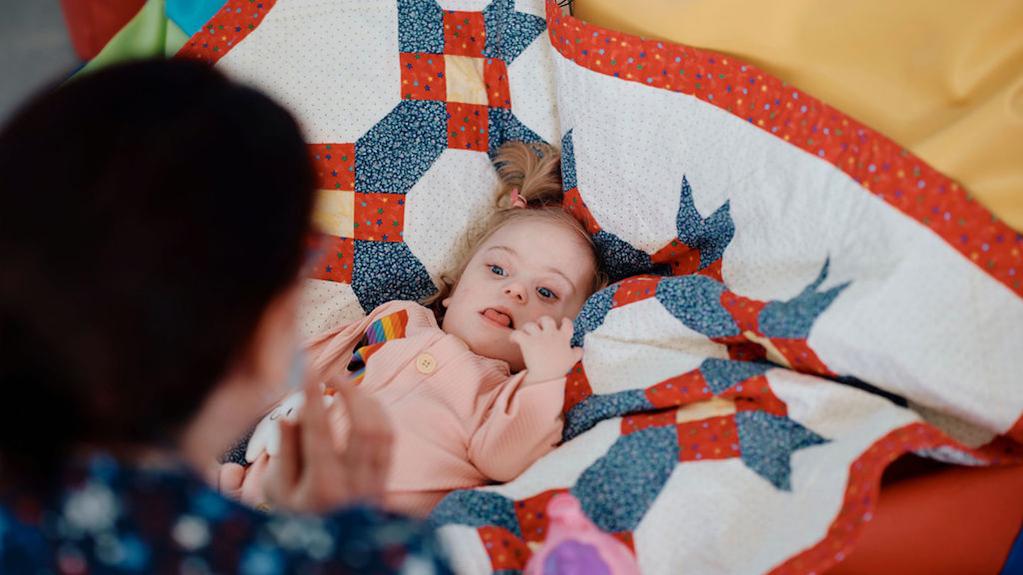 Image of baby and nurse in sensory room at Jersey Hospice Care