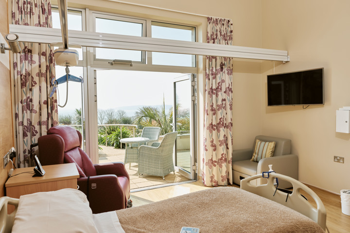 Image of an In Patient Unit room at Jersey Hospice Care with balcony doors open