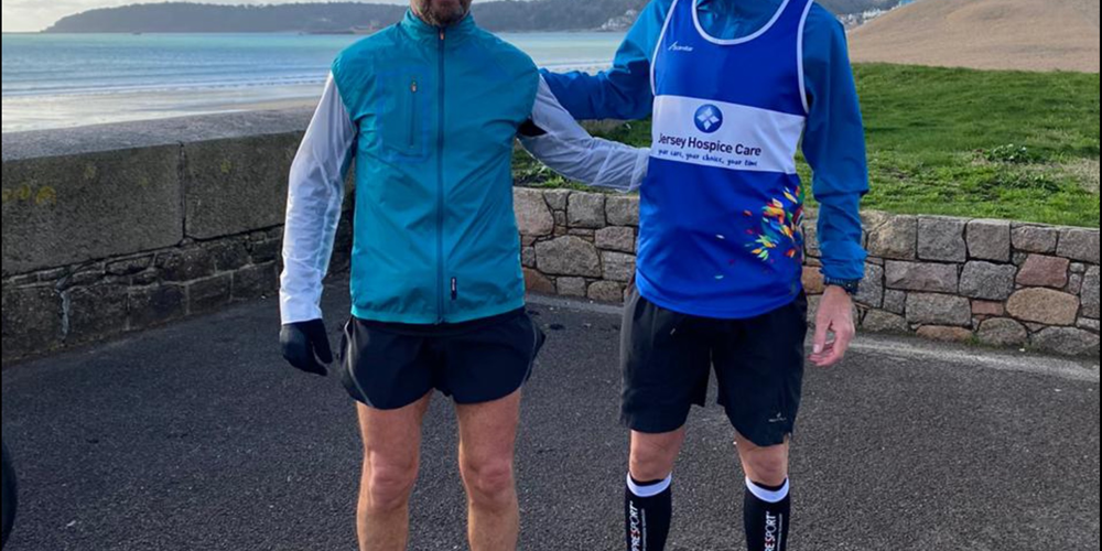 Image of two men taking part in running challenge in aid of Hospice