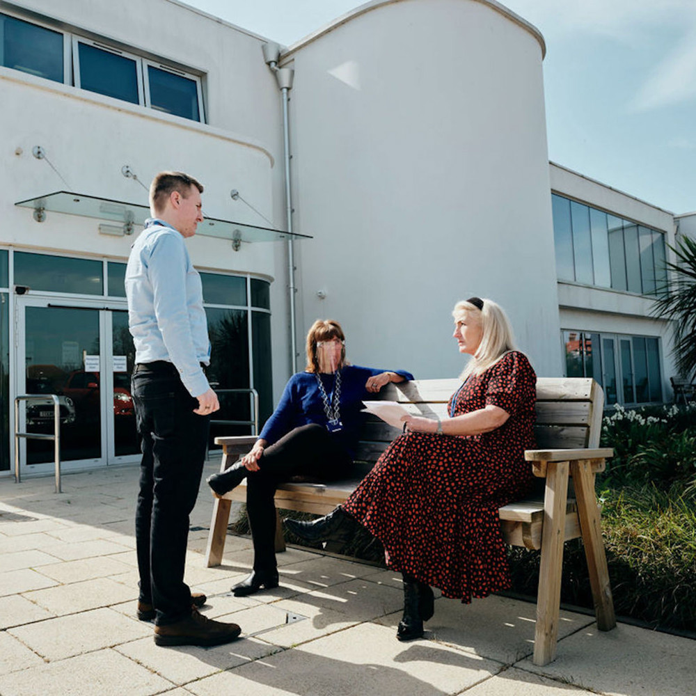 Image of staff taking outside Hospice building
