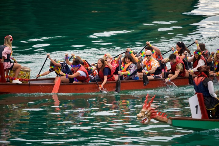Image of two dragon boats racing