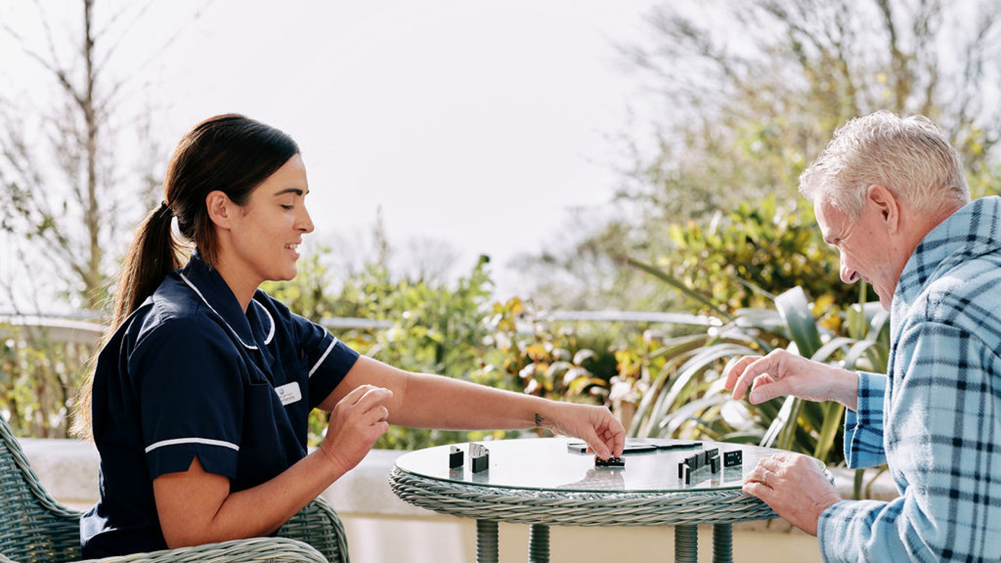 Nurse and patient in garden