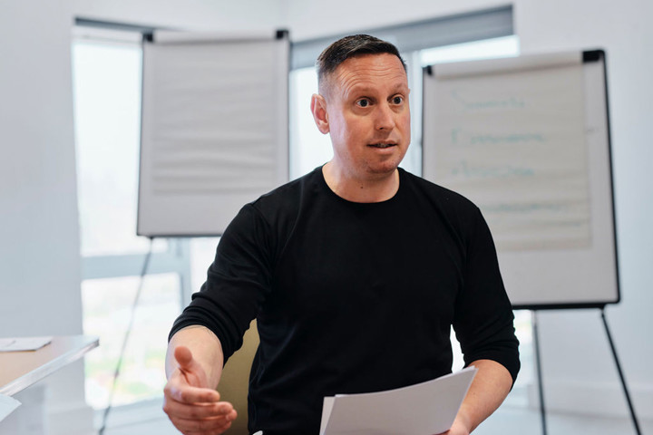 Image of education manager delivering training session