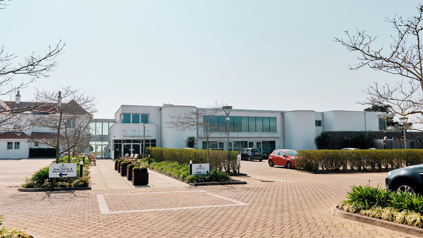Image of hospice building taken from car park